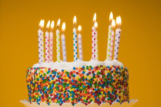 Decorated confetti cake with candles