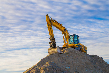 tractor excavator in a construction site mountain hill
