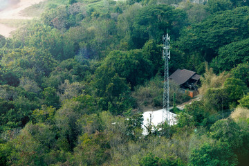 Obraz premium Cellular Base Station and Tower in Rural Area. COPY SPACE.