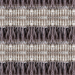 Background of knitted loops and fringe