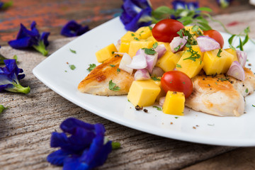 Clean food, Grilled chicken breasts , mango , tomato and vegetables.