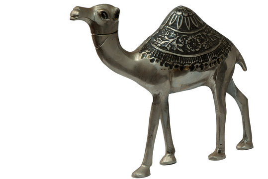Metal model of a camel against a white background