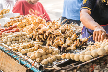 Charcoal grilled food brochette for sale at a local market in Bangkok, Thailand.