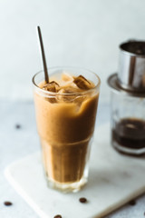 Vietnamese coffee on concrete background.