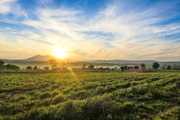 The natural landscape of mountains range and field in sunlight