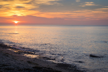 Fototapeta na wymiar Sonnenuntergang über dem Meer - Ostsee auf Insel Rügen