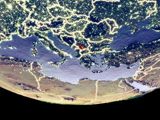 Satellite view of Kosovo from space at night. Beautifully detailed plastic planet surface with visible city lights.