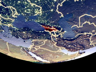 Satellite view of Georgia from space at night. Beautifully detailed plastic planet surface with visible city lights.