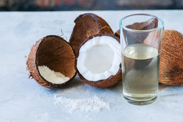 Coconut water, whole coconuts on a white background. Coconut products concept.