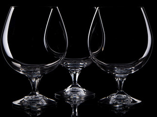 Silhouette of empty  three drinking glass  on black background 