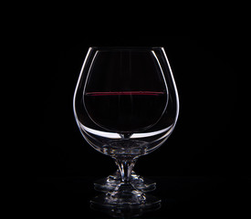 isolate two drinking glass  with red wine one after the other on black background