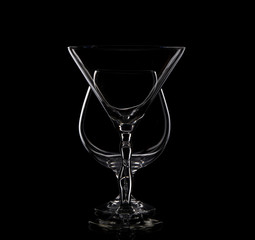 isolate two drinking glass  one after the other on black background