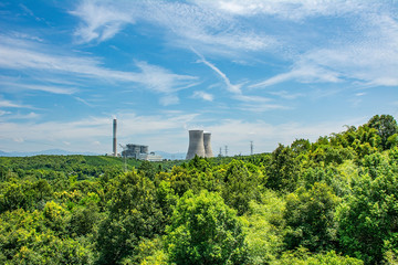 Obraz premium Chimneys and cooling towers of coal-fired power plants