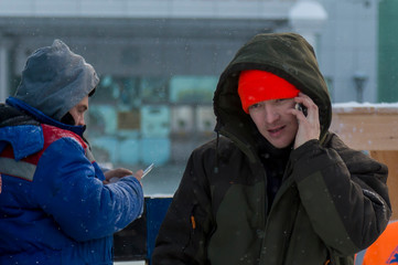 Portrait of an installer talking on a mobile phone