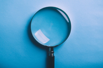 Magnifying Isolated On Blue Background