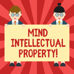 Conceptual hand writing showing Mind Intellectual Property. Business photo showcasing Refers to creations of the mind such as invention Male and Female in Uniform Holding Placard Banner Text Space