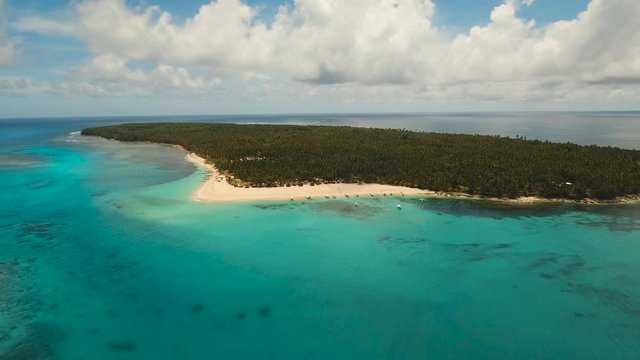 aerial footage tropical island with beach and palm trees lagoon with turquoise water Sea tropical landscape Daco island, Philippines, Siargao. Travel concept Aerial video