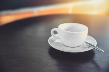 white coffee cup mug on wooden table.