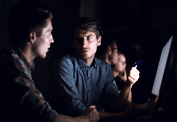 close up.employees of the company are discussing new information