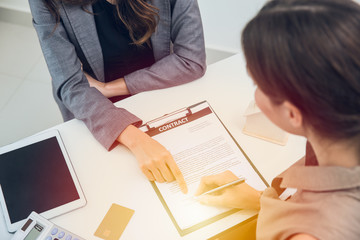 business women sign contract