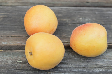 natural, organic apricot on a wooden background