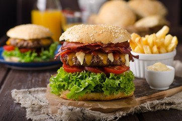 Homemade bacon burger with lettuce and cheddar