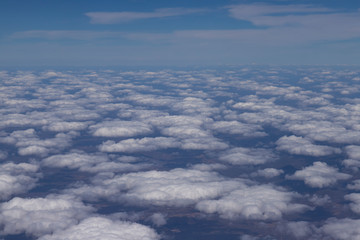 Flying above the clouds. View from the airplane, soft focus. 