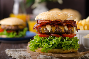 Homemade bacon burger with lettuce and cheddar