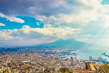 Naklejka premium Napoli or Naples and mount Vesuvius in the background at sunset in a summer day