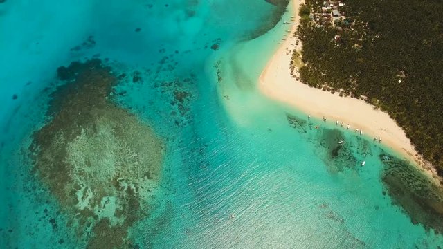 aerial footage tropical island with beach and palm trees lagoon with turquoise water Sea tropical landscape Daco island, Philippines, Siargao. Travel concept Aerial video