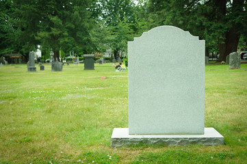 Large blank tombstone in old cemetery