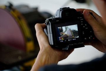 A camera capture student doing capenter in class