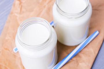 milk with cookies on a wooden background