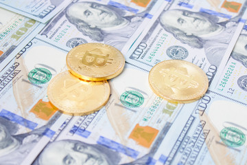Golden bitcoins on euro,dollar, hryvnia banknotes. Financial background