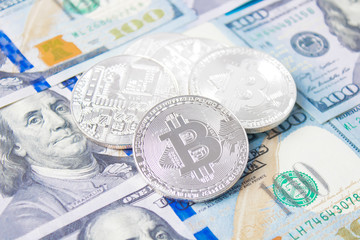 Golden bitcoins on euro,dollar, hryvnia banknotes. Financial background