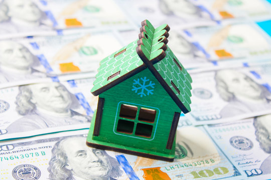 Close up on pile of many bank notes from various countries from around the world. U.S., German, Swiss, Canadian, Brazilian, Vietnamese, Mexican. Many countries represented in currency.
