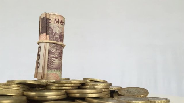 Mexican pesos roll over mexican coins