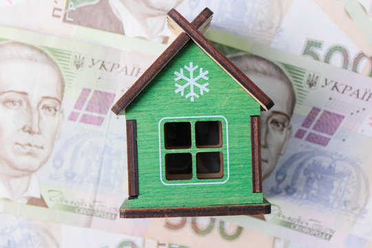 Close up on pile of many bank notes from various countries from around the world. U.S., German, Swiss, Canadian, Brazilian, Vietnamese, Mexican. Many countries represented in currency.