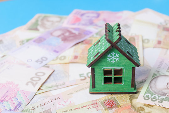 Close up on pile of many bank notes from various countries from around the world. U.S., German, Swiss, Canadian, Brazilian, Vietnamese, Mexican. Many countries represented in currency.