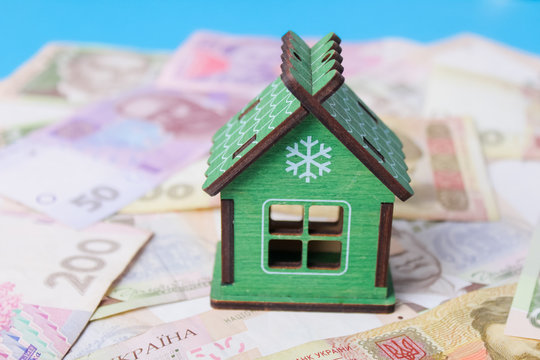 Close up on pile of many bank notes from various countries from around the world. U.S., German, Swiss, Canadian, Brazilian, Vietnamese, Mexican. Many countries represented in currency.