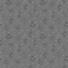 Seamless floral pattern with plant silhouettes and snowflakes on gray background