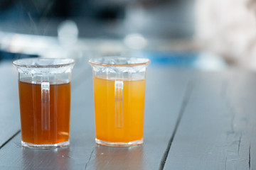 Colorful Christmas punch (punsch) or gluhwein in plastic cups