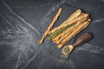 Top view of traditional italian appetizer grissini with rosemary spice