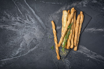 Top view of traditional italian appetizer grissini with rosemary spice