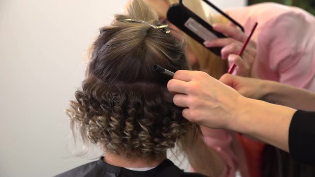 Curling hair styling and makeup for a women