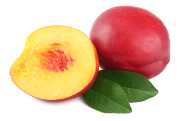 Nectarine with green leaf and slices isolated on white background.