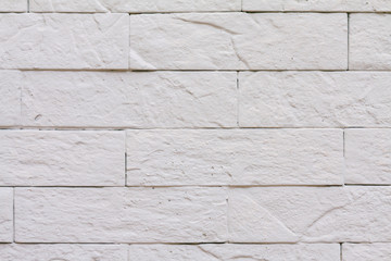 Background rough brick wall painted with white paint