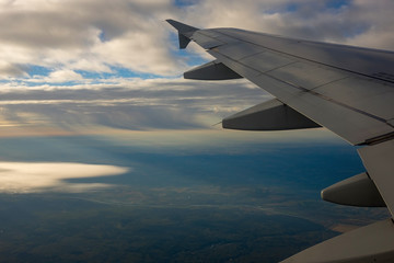 Fototapeta premium Airplane Wing in Flight, looking through window
