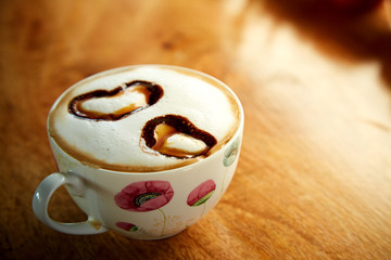 Cup cappucino with heart shaped