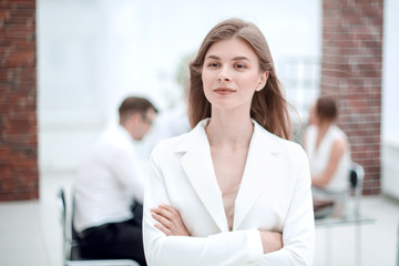 dreams of a young business woman standing in office